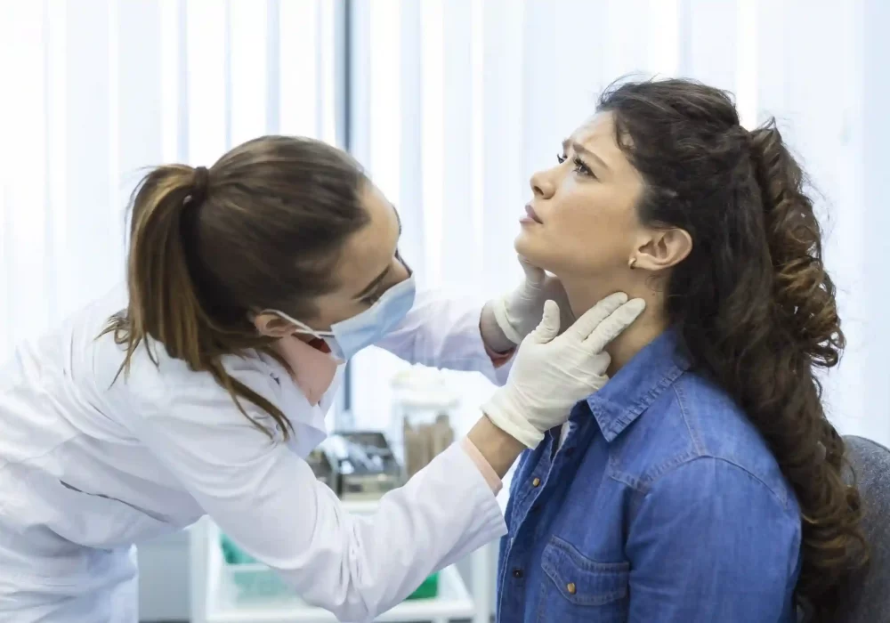 Doctor examining patient’s neck for lymph node cancer detection and diagnosis